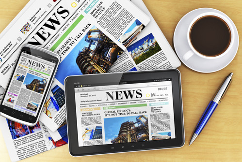 Tablet computer, smartphone and newspapers